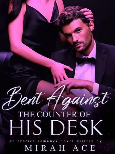 Bent Against The Counter Of His Desk